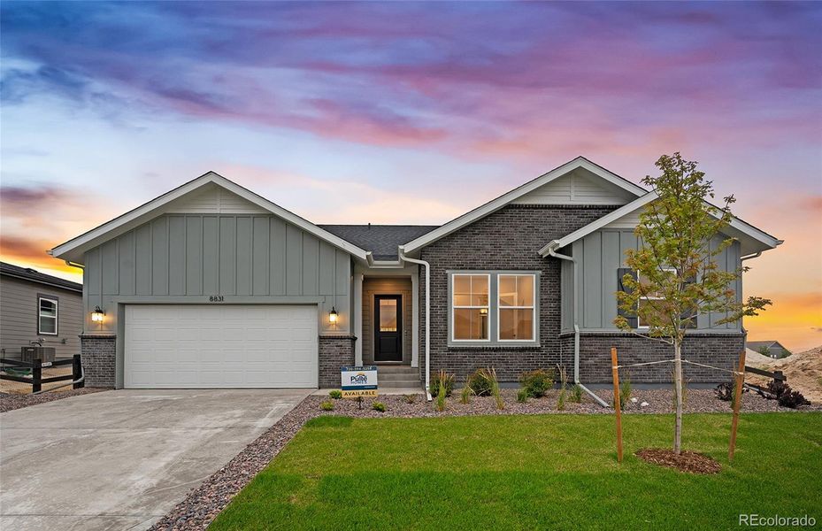 Front exterior of a new home in Hilltop at Inspiration, Aurora, CO, highlighting curb appeal (Image 1).