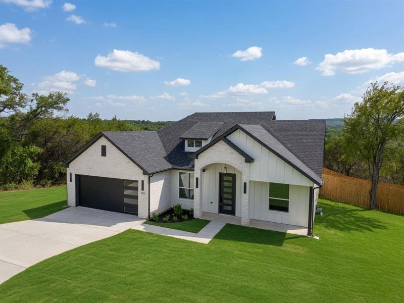Front exterior of a new home in , Granbury, TX, highlighting curb appeal (Image 24). Front exterior of a new home in , Granbury, TX, highlighting curb appeal (Image 24).