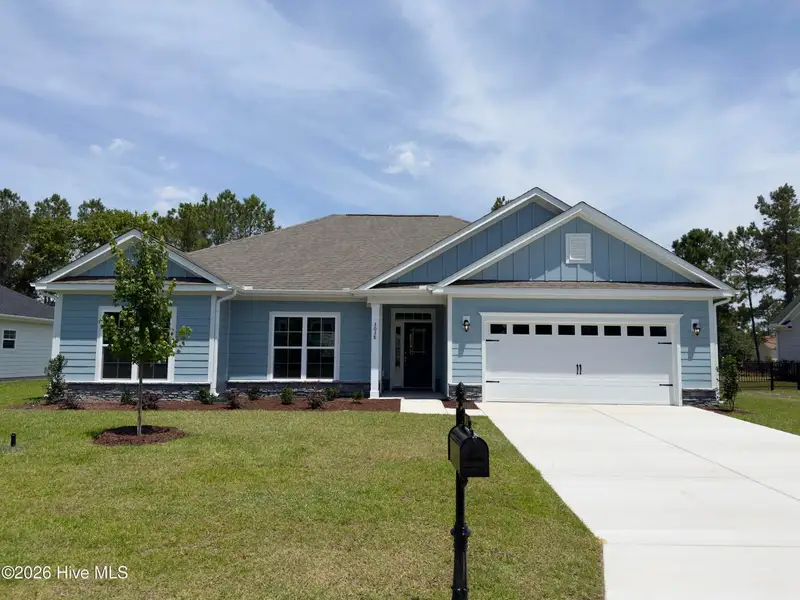 Front exterior of a new home in Rutledge, Shallotte, NC, highlighting curb appeal (Image 1). Front exterior of a new home in Rutledge, Shallotte, NC, highlighting curb appeal (Image 1).