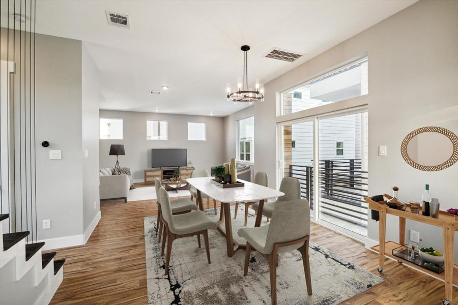 Large dining area conveniently located adjacent to the kitchen and living area*This area has been virtually staged Large dining area conveniently located adjacent to the kitchen and living area*This area has been virtually staged