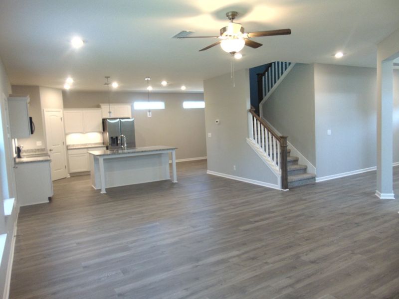 This spacious and enlightened family room where you can host movie nights, and holiday fun in the comfort of your home.