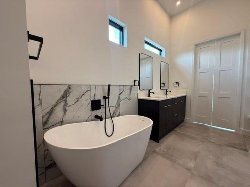 Luxuriate in the spacious stand-alone tub, perfectly complementing the elegant primary bath.