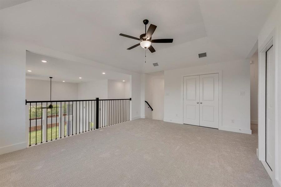 Spare room featuring ceiling fan, light colored carpet, and recessed lighting Spare room featuring ceiling fan, light colored carpet, and recessed lighting