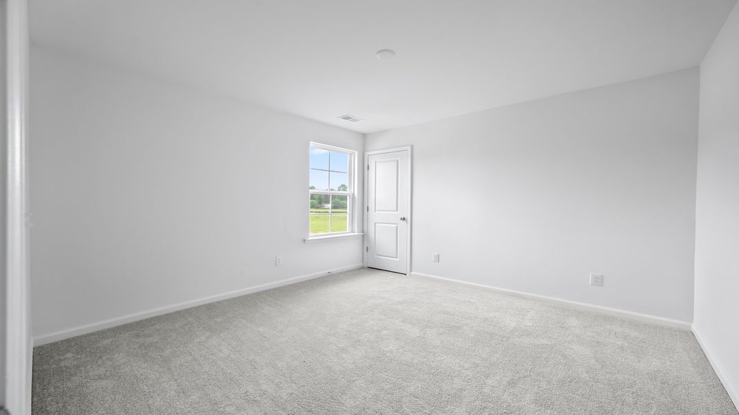 Bedroom 2 in the Pritchard provides comfort and versatility