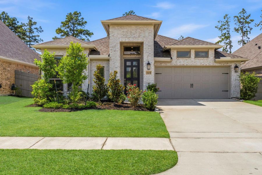 Front exterior of a new home in Artavia, Conroe, TX, highlighting curb appeal (Image 30). Front exterior of a new home in Artavia, Conroe, TX, highlighting curb appeal (Image 30).