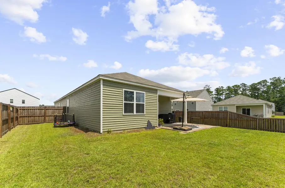 Exterior details and patio area of a home in Pine Hills at Cane Bay, Summerville (Image 29).