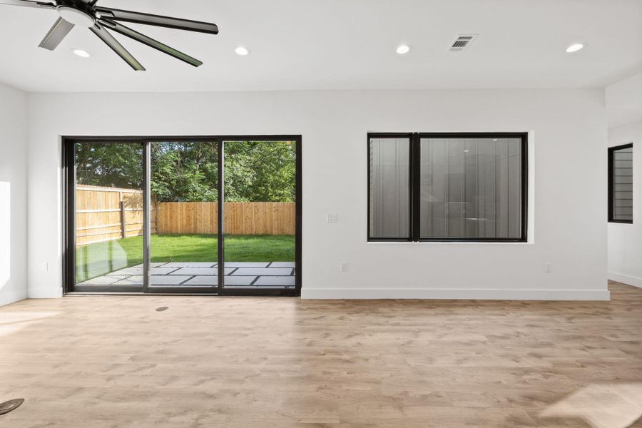 Glass sliding doors and large windows at living room