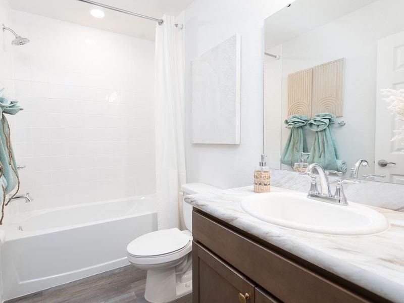 An upstairs hall bath serves bedrooms 4 and 5 - Wesley II by Highland Homes An upstairs hall bath serves bedrooms 4 and 5 - Wesley II by Highland Homes
