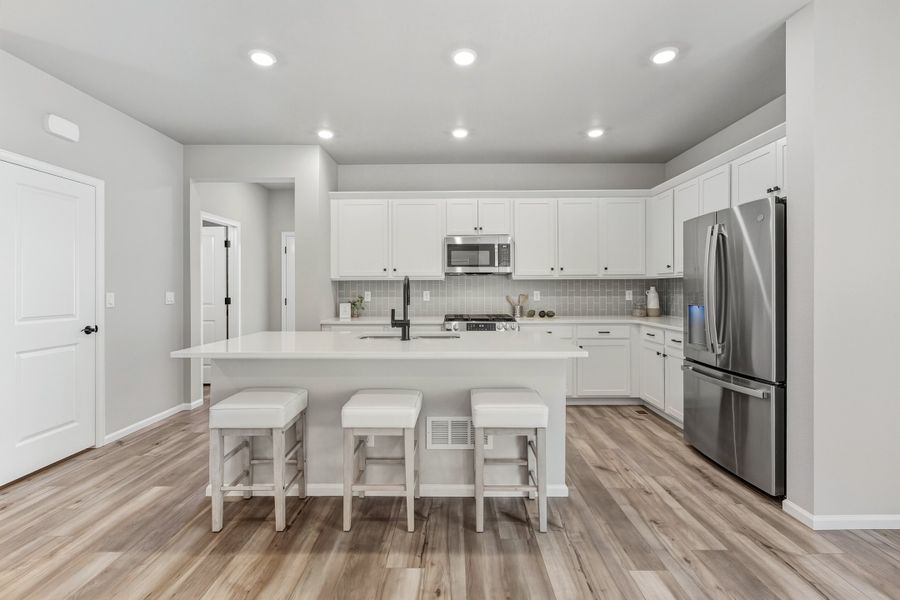 Furnished interior view inside a new home in Woodrose at Painted Prairie, Aurora (Image 3).