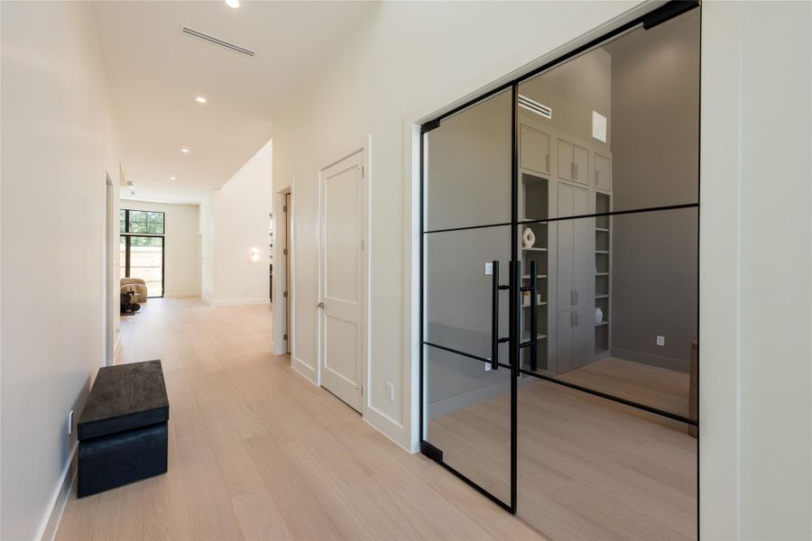 The foyer offers a striking introduction to the home, with clean sightlines leading toward the private study, where a glass entry adds architectural interest while preserving the openness of the space. The foyer offers a striking introduction to the home, with clean sightlines leading toward the private study, where a glass entry adds architectural interest while preserving the openness of the space.