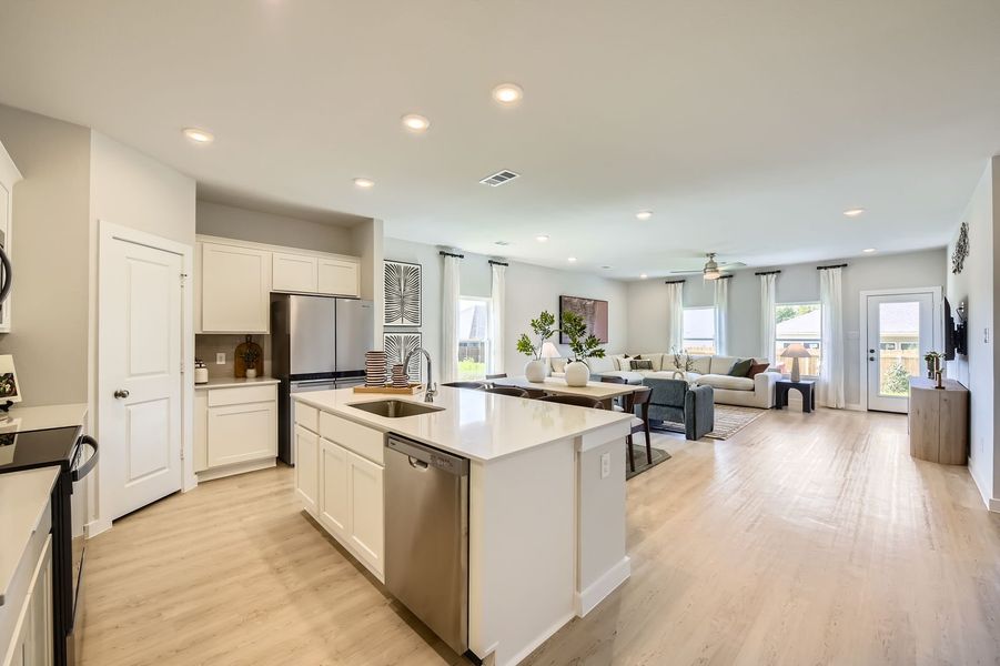 A kitchen with white cabinets. A kitchen with white cabinets.