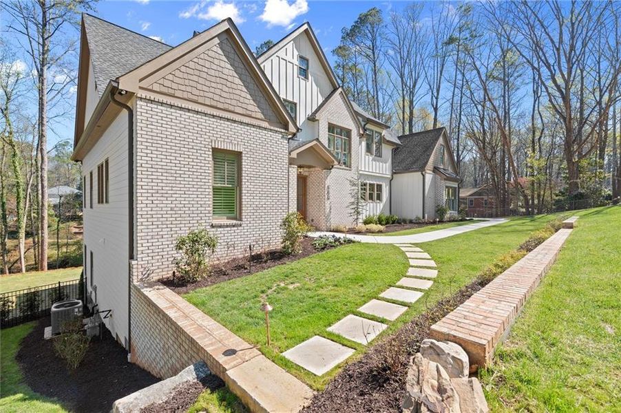 Front exterior of a new home in , Marietta, GA, highlighting curb appeal (Image 30). Front exterior of a new home in , Marietta, GA, highlighting curb appeal (Image 30).