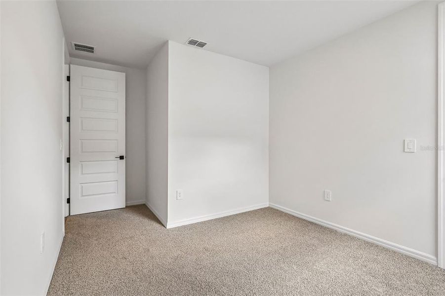 Spacious, unfurnished interior of a new home in The Grove at Stuart Crossing - Signature Series, Bartow (Image 16).