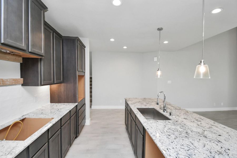 Additional view of your culinary haven with tons of counter space. Sample photo of completed home with similar floor plan. Actual colors and selections may vary. Additional view of your culinary haven with tons of counter space. Sample photo of completed home with similar floor plan. Actual colors and selections may vary.