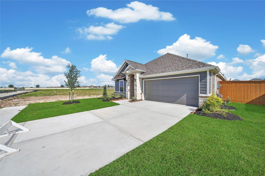 Front exterior of a new home in , Rosharon, TX, highlighting curb appeal (Image 22).