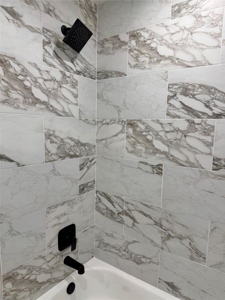 Bathroom featuring shower / bath combination