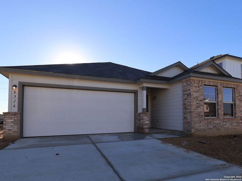 Front exterior of a new home in Agave, San Antonio, TX, highlighting curb appeal (Image 24). Front exterior of a new home in Agave, San Antonio, TX, highlighting curb appeal (Image 24).