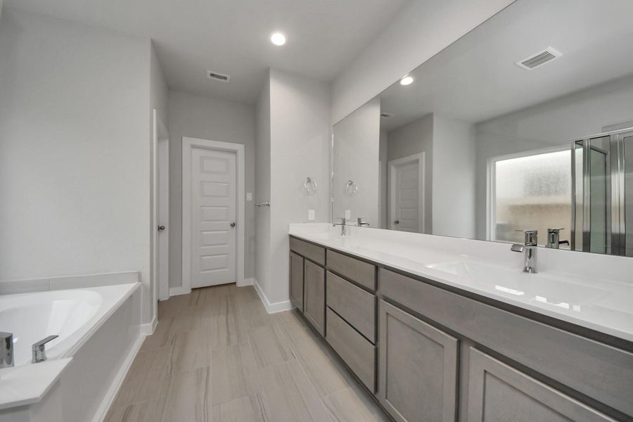 Elevate your dailyroutine at the elegant vanity, now equipped with double sinks, lightcountertops, modern hardware, and beautiful recessed lights. Sample photo of completed home with similar floor plan. Actual colors and selections may vary. Elevate your dailyroutine at the elegant vanity, now equipped with double sinks, lightcountertops, modern hardware, and beautiful recessed lights. Sample photo of completed home with similar floor plan. Actual colors and selections may vary.
