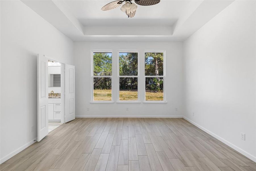 The Primary Retreat Features A Beautiful Wall Of Windows