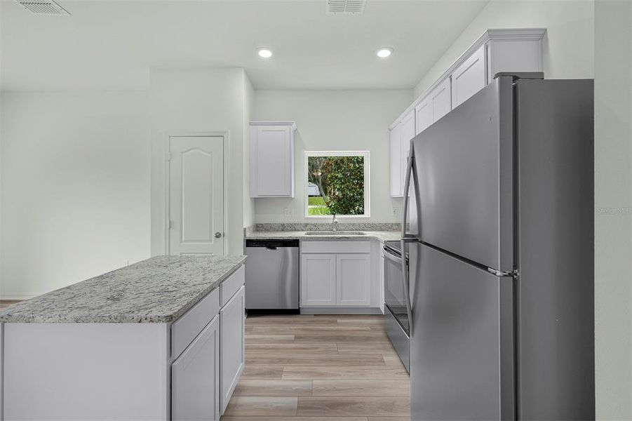 Furnished interior view inside a new home in Tula Parc, Astatula (Image 10).