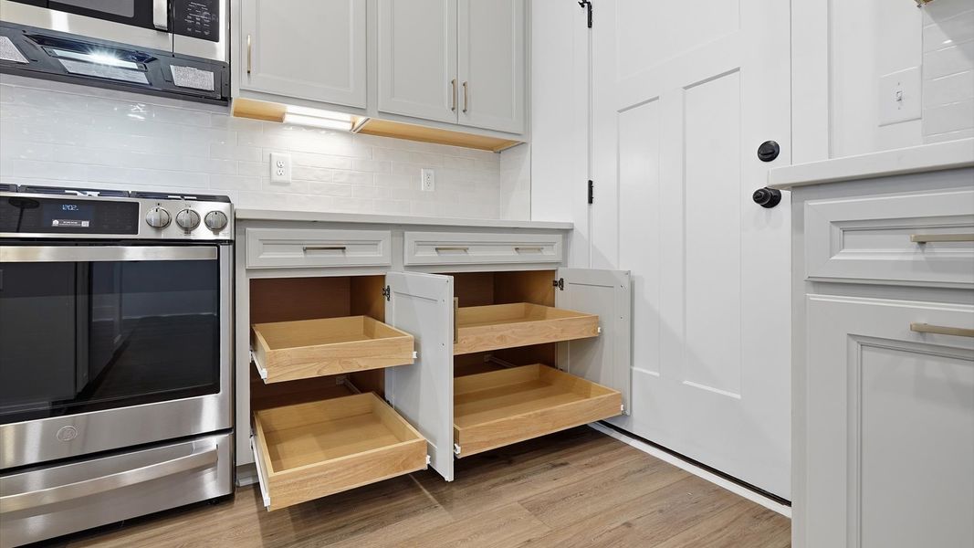 Tasteful kitchen with ample storage and modern finishes in a first-class DRB Homes design Tasteful kitchen with ample storage and modern finishes in a first-class DRB Homes design