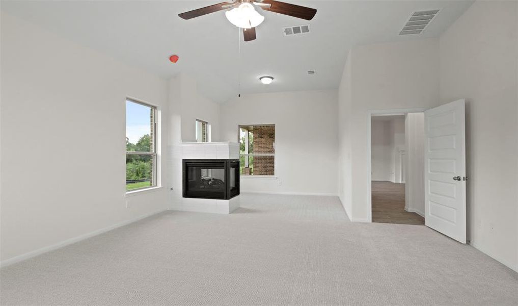 Owner's suite with sitting area and fireplace