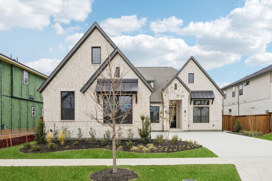 Front exterior of a new home in Canyon Falls 70s, Argyle, TX, highlighting curb appeal (Image 21).