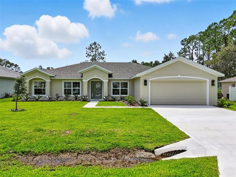 Front exterior of a new home in , Palm Coast, FL, highlighting curb appeal (Image 23).