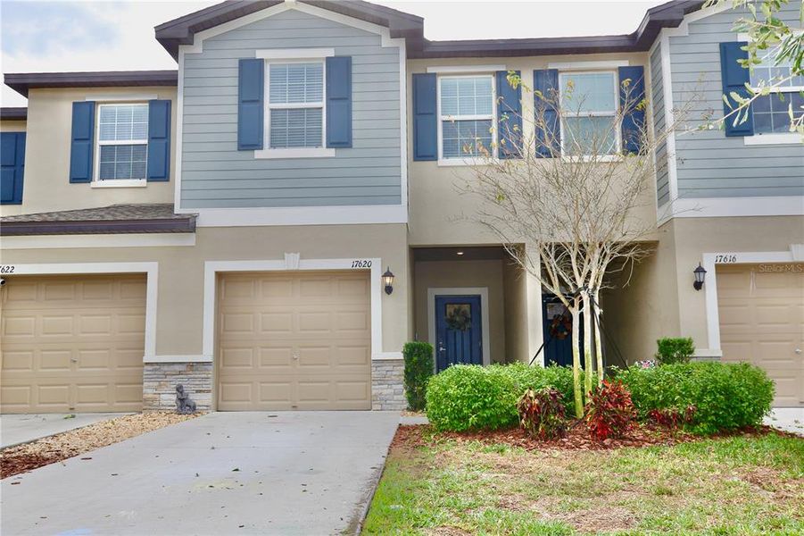 Front exterior of a new home in , Land O' Lakes, FL, highlighting curb appeal (Image 22).