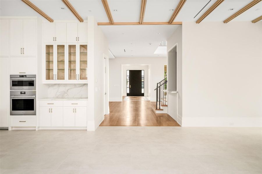 A seamless transition from Italian porcelain to French oak defines the home’s thoughtful flow and material contrast.