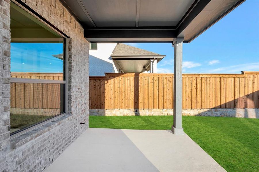 Fenced backyard with a patio Fenced backyard with a patio