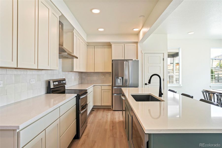 Modern kitchen with ample cabinetry, stainless steel appliances, and functional layout, designed for both style and efficiency in this move-in ready Morrison home