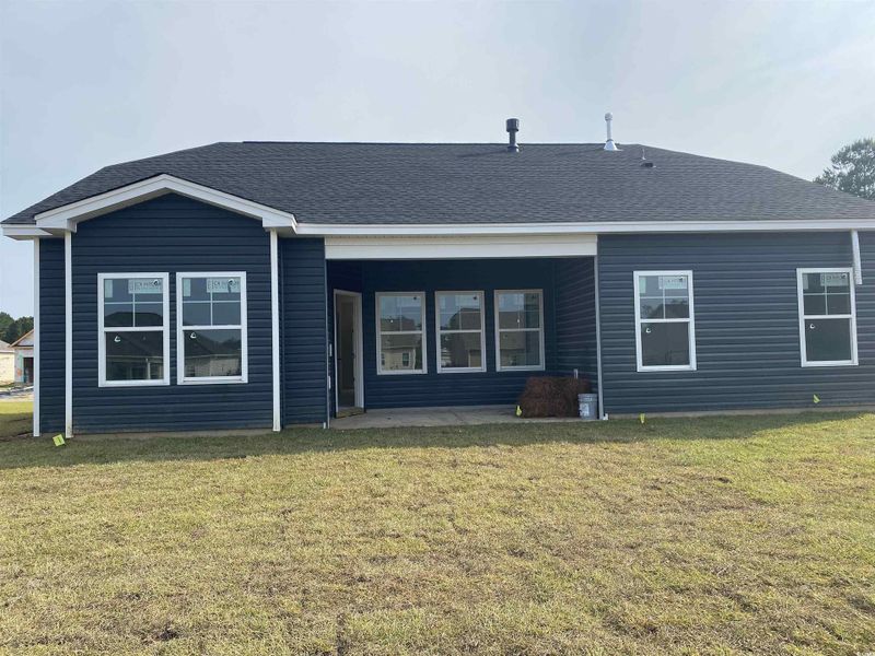 Exterior details and patio area of a home in Oak Hollow, Longs (Image 3).