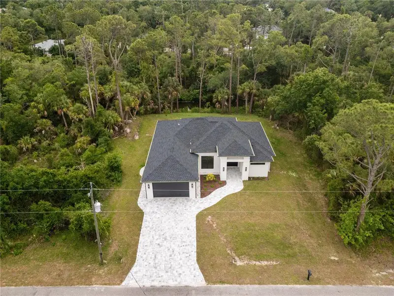 Front exterior of a new home in , North Port, FL, highlighting curb appeal (Image 30).