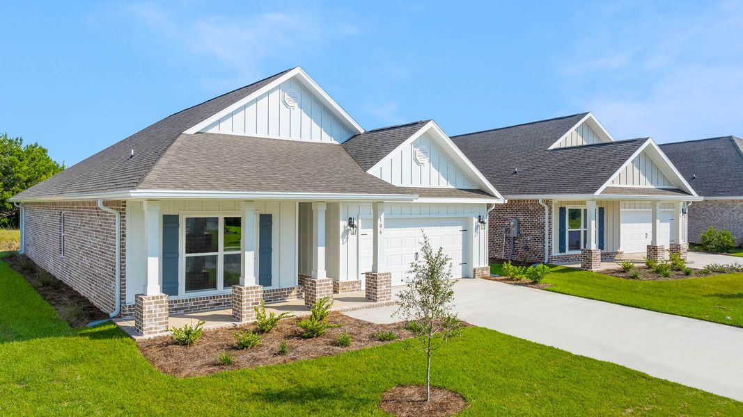 Front exterior of a new home in Owl's Head Farms, Freeport, FL, highlighting curb appeal (Image 17).
