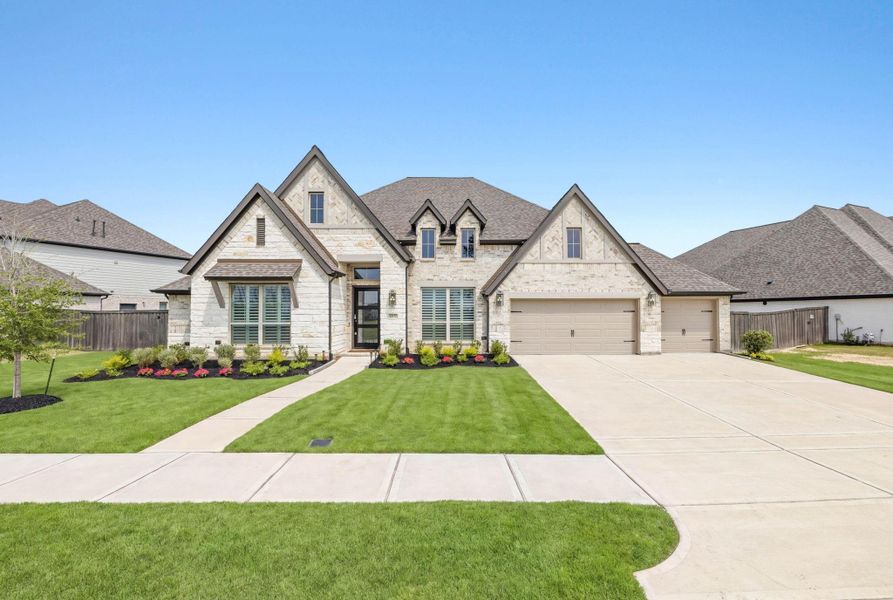 Front exterior of a new home in Riceland, Mont Belvieu, TX, highlighting curb appeal (Image 28).
