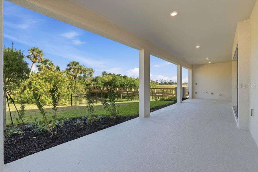 Exterior details and patio area of a home in Indigo Creek, Apollo Beach (Image 16).