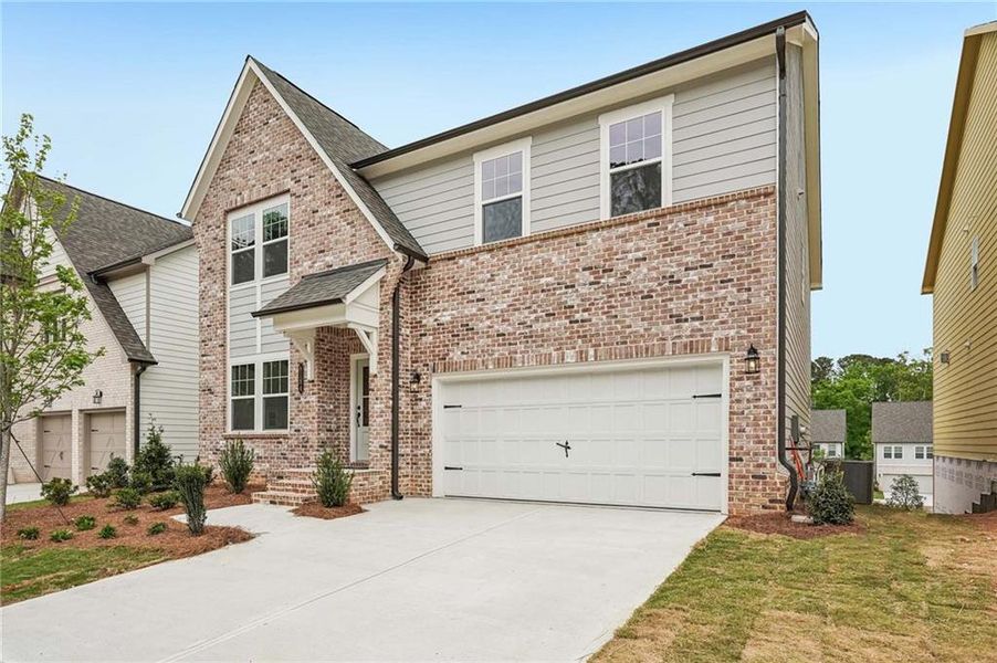 Front exterior of a new home in Arbors at Richland Creek, Buford, GA, highlighting curb appeal (Image 1). Front exterior of a new home in Arbors at Richland Creek, Buford, GA, highlighting curb appeal (Image 1).