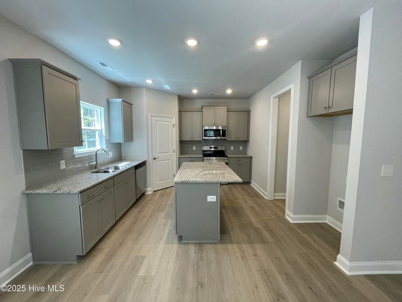 Furnished interior view inside a new home in Mill Creek Cove, Bolivia (Image 4).