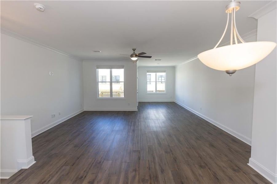 Dining area opens to the family room*Photo of model home in a different community. Used for illustrative purposes only*