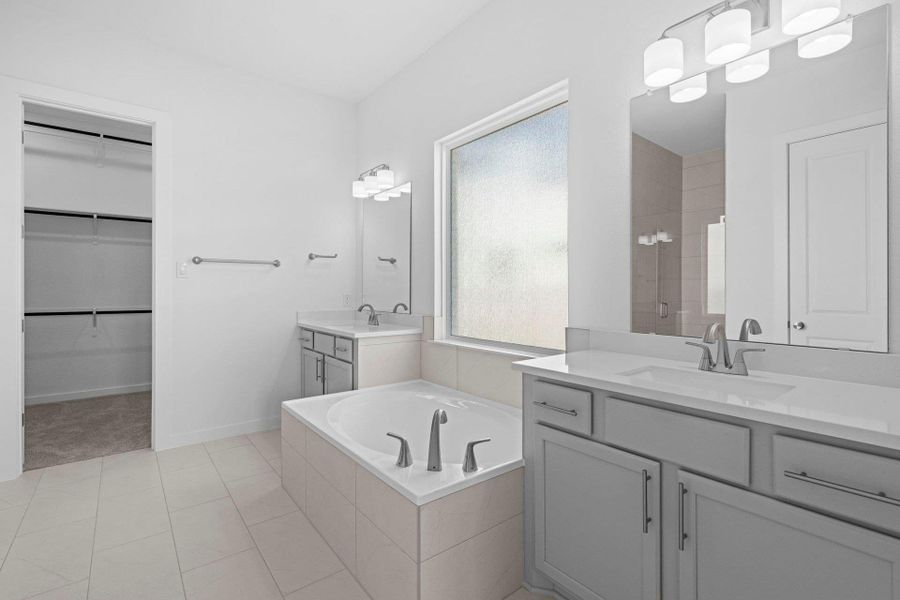 Primary Bath retreat with dual vanities & garden tub