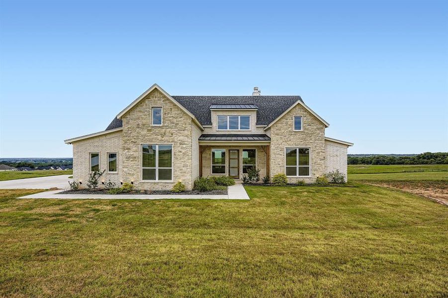 Front exterior of a new home in , Springtown, TX, highlighting curb appeal (Image 1). Front exterior of a new home in , Springtown, TX, highlighting curb appeal (Image 1).