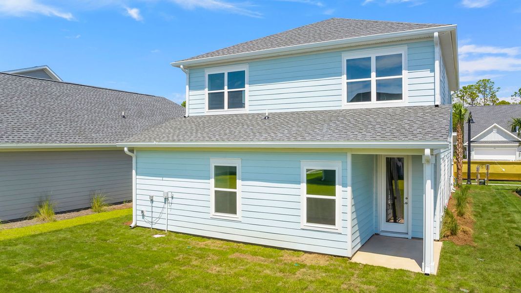 Front exterior of a new home in Breakfast Point East Phase I, Panama City Beach, FL, highlighting curb appeal (Image 20). Front exterior of a new home in Breakfast Point East Phase I, Panama City Beach, FL, highlighting curb appeal (Image 20).