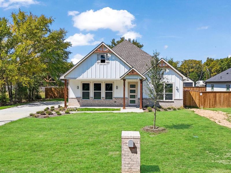 Front exterior of a new home in , Tool, TX, highlighting curb appeal (Image 21). Front exterior of a new home in , Tool, TX, highlighting curb appeal (Image 21).