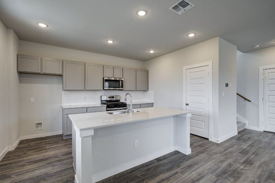 A kitchen with white cabinets. A kitchen with white cabinets.