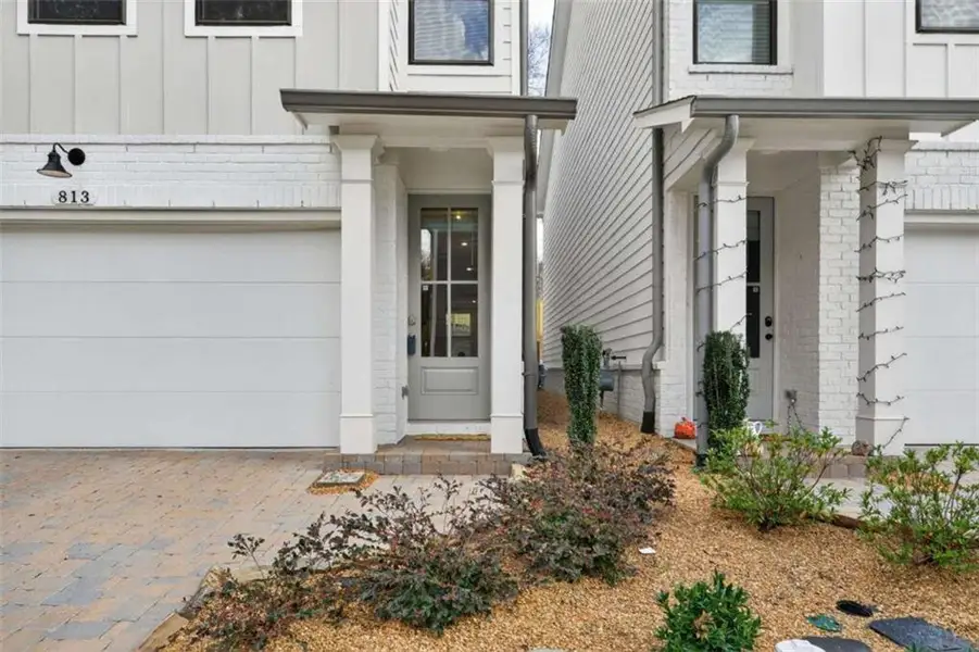 Exterior details and patio area of a home in The Village at Towne Lake, Woodstock (Image 3).