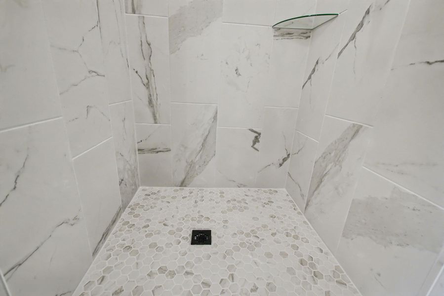Full bathroom with a tile shower