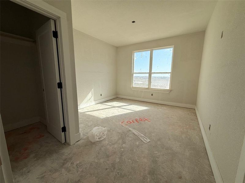 Unfurnished bedroom with baseboards