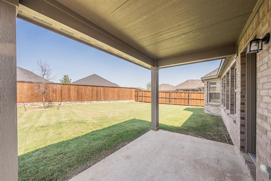 Fenced backyard with a patio Fenced backyard with a patio