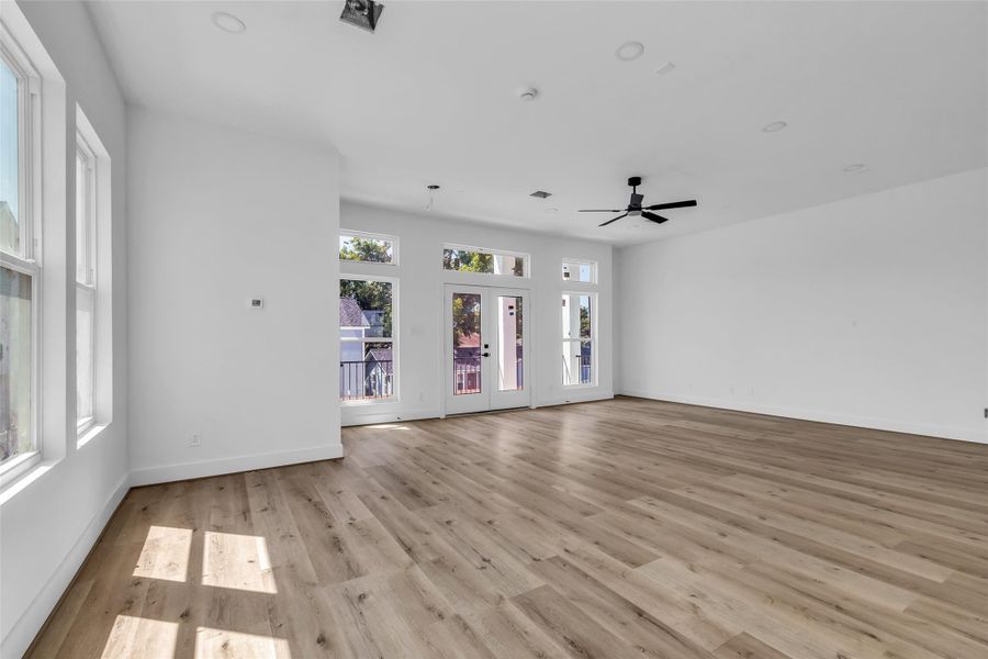 Another angle of this stunningliving room, featuring beautifulwooden floors and direct access tothe balcony, perfect for i Another angle of this stunningliving room, featuring beautifulwooden floors and direct access tothe balcony, perfect for i